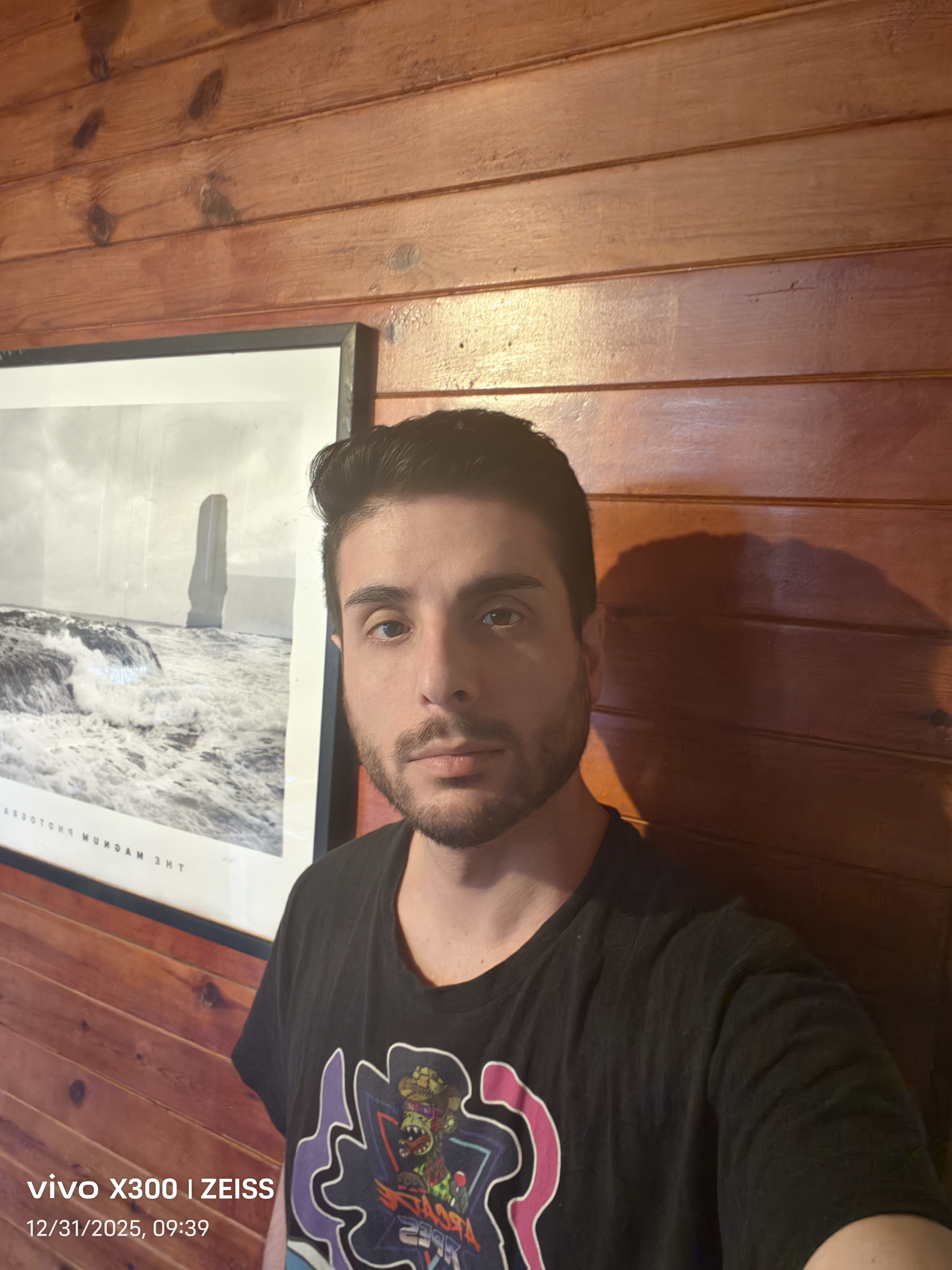 Salvatore Santillo, reception manager at a law firm, casual portrait with wood wall background